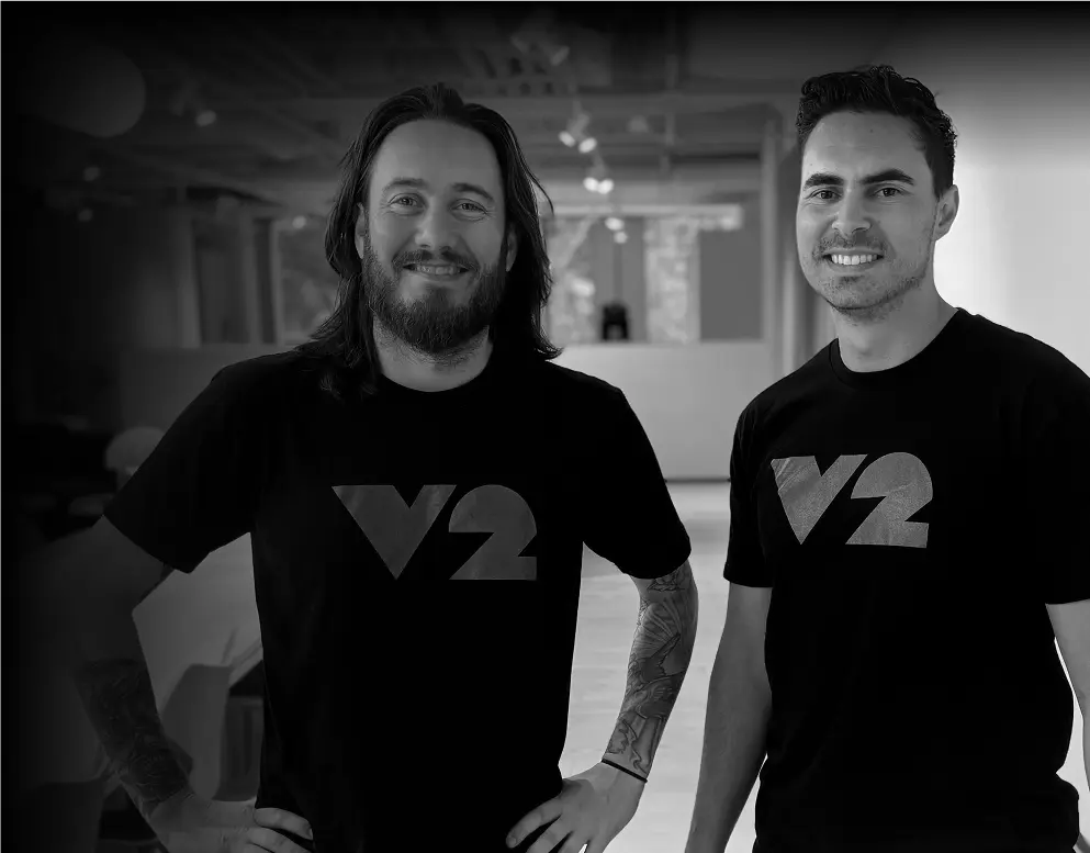 Grayscale photograph of two of V2 AI's high quality consultants