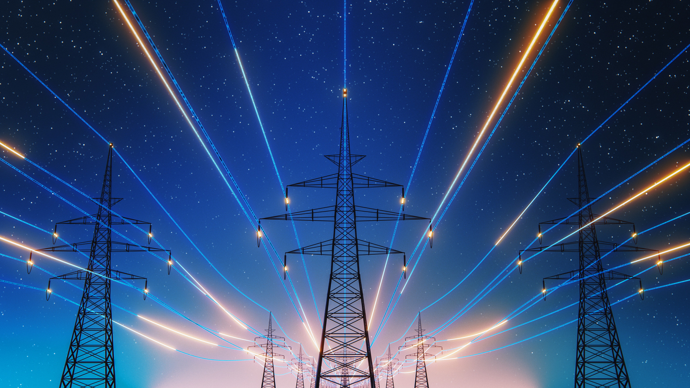 Power lines with glowing light trails, representing how AI is transforming the energy sector.
